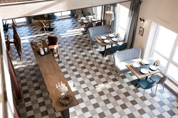 Top view of restaurant hall with setting places Top view of restaurant hall with setting places